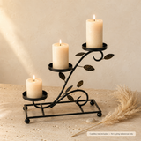 3 Tier Cascading Candle Stand in Black & Gold holding three pillar candles, with pampas grass