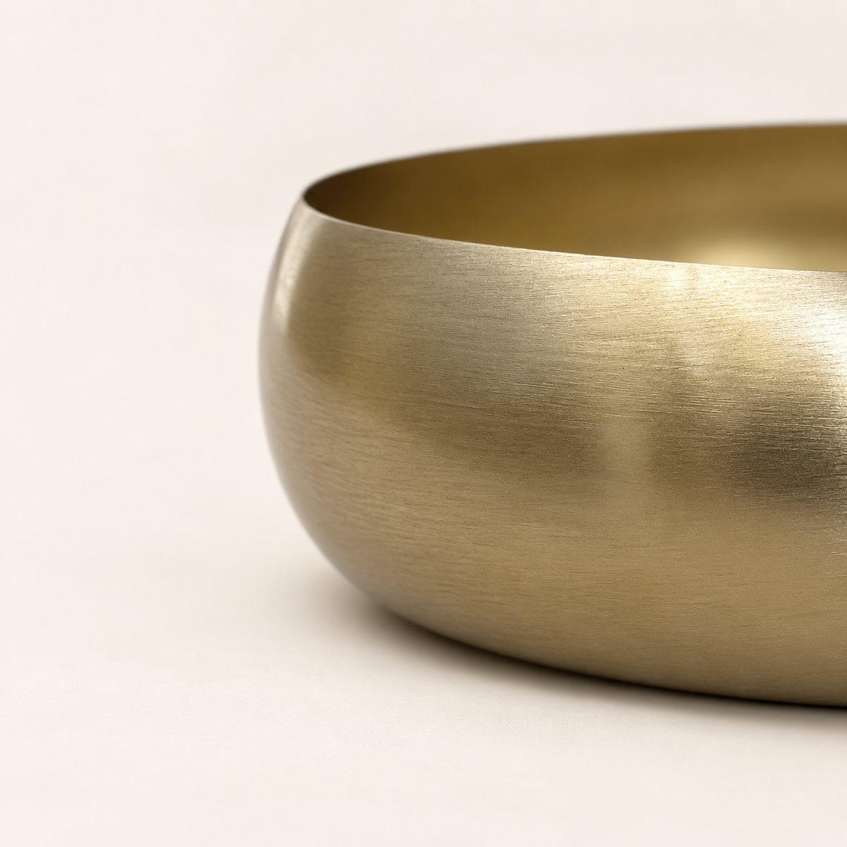 Close-up of the Ekam Metal Urli brass finish and rim