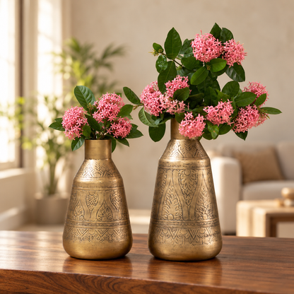 Aurum 12 inch and 15 inch antique brass finish vases with pink flowers on a wooden table
