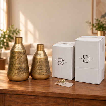 Two Aurum vases beside two Elements of Decor gift boxes and a thank-you card