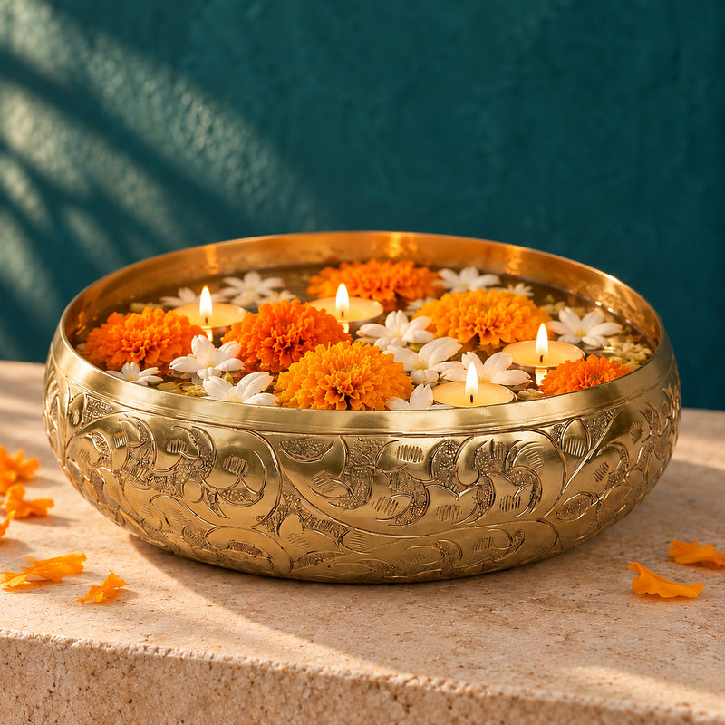 Chitra Chitai Urli, a hand-chased golden bowl with floating flowers and tealights