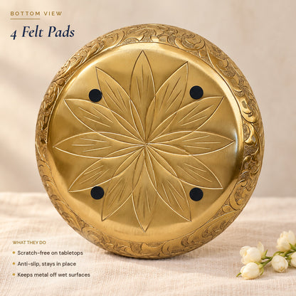 Underside of the Chitra urli with the lotus and four black felt pads