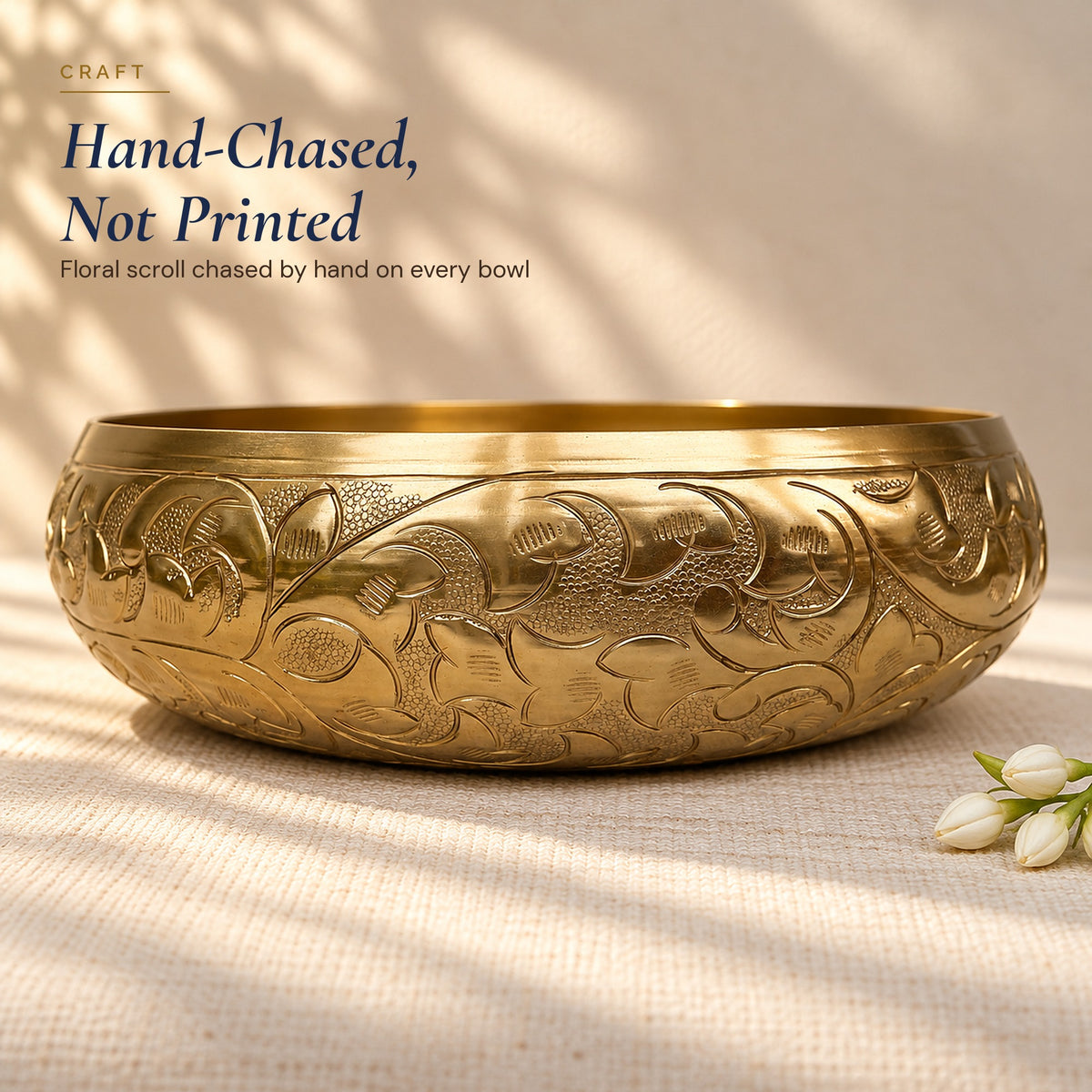 Close-up of the hand-chased floral scroll on the Chitra urli