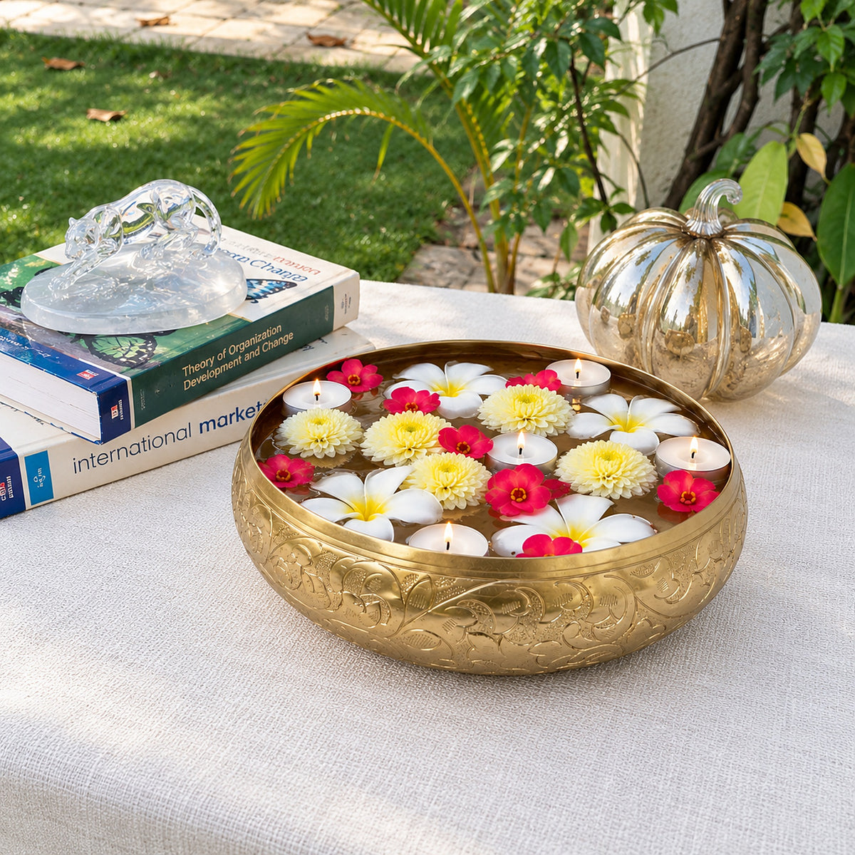 Chitra urli with floating flowers in a garden