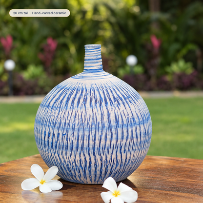 Imber Round Bud ceramic vase in Ocean Blue, styled in a room