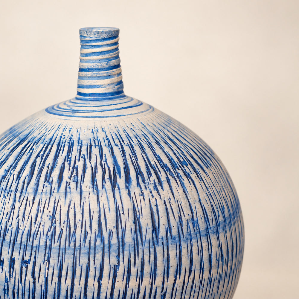 Hand-carved relief close-up on the Imber Round Bud Ocean Blue ceramic vase